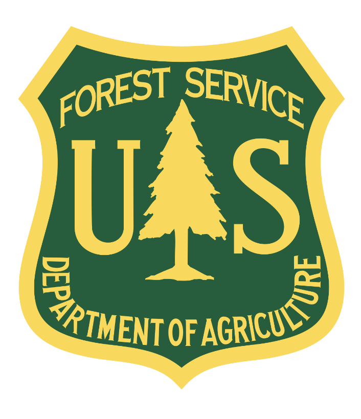 A crest with an image of a tree and the words, "US Forest Service, Department of Agriculture"